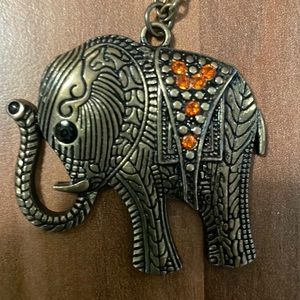 Good luck retro elephant with blue stone eye and red stones on his saddle